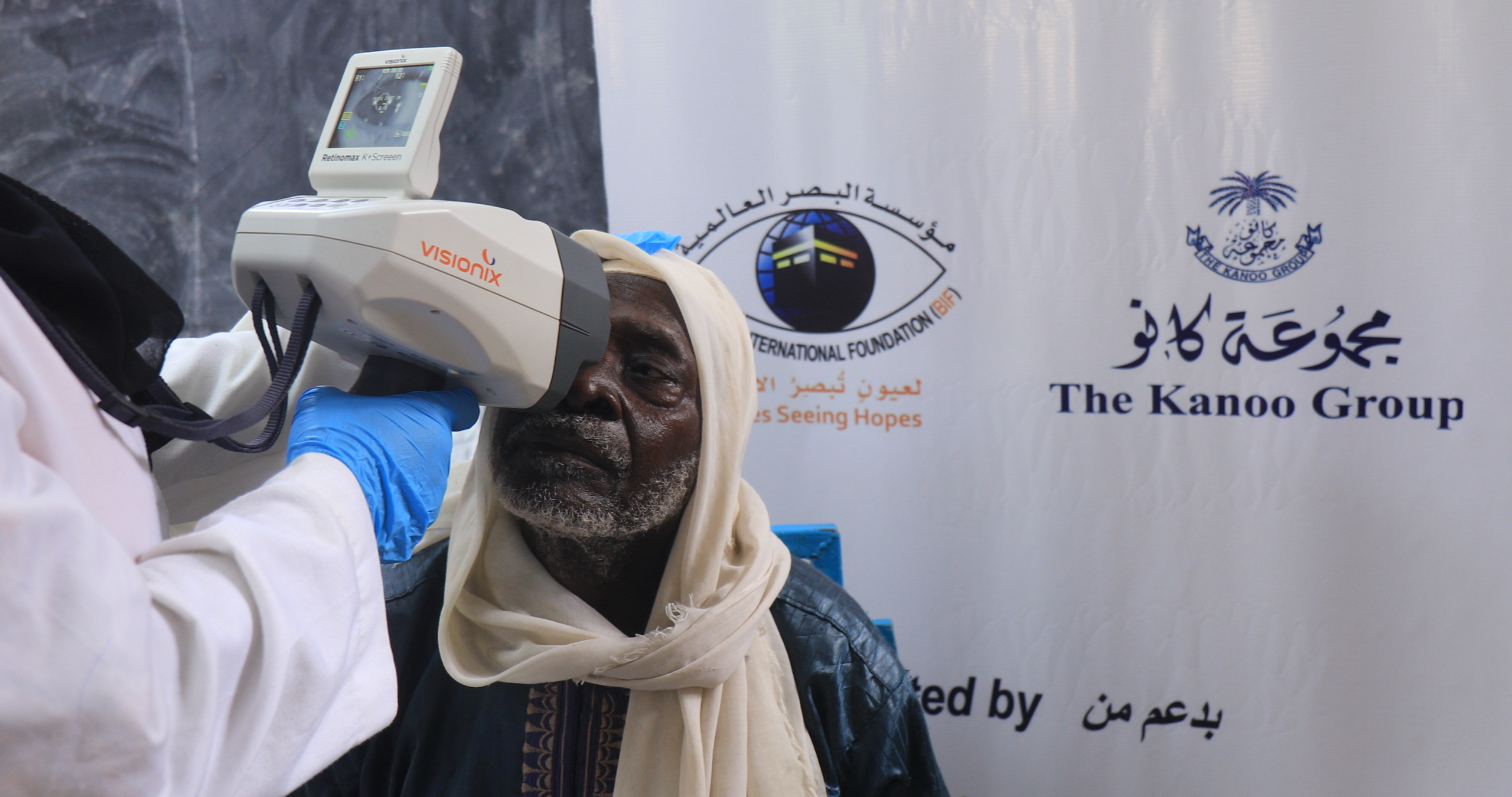 Al Basar Doctor performing eye examination during an outreach camp